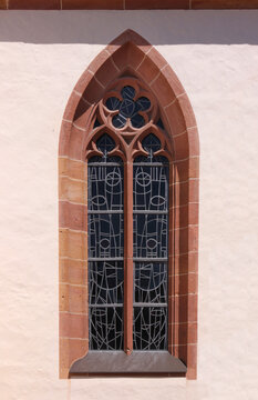 Pointed ogive window with gothic cinquefoil tracery at the church of Schaidt, city of W&ouml;rth am Rhein in Germany