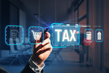 Digital tax interface with business icons and man interacting on futuristic screen in modern office background.