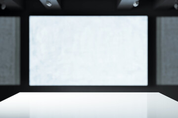 Abstract modern indoor space with a white podium and blurred background of rectangular panels in a...