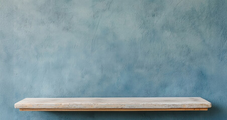 Blank wooden shelves on a concrete wall
