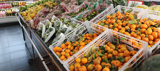 Oranges fruit on rack stall in grocery store. Healthi food with vitamin c