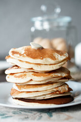 Hot homemade stack of pancakes with butter. Brunch time. High quality photo