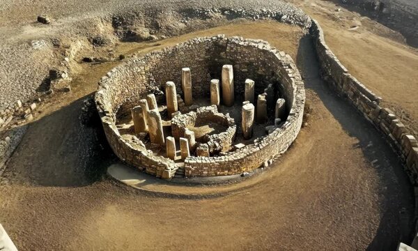 Camera flying above the ruins of ancient temple, 4K