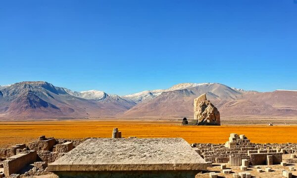 Ruins of ancient Persepolis, remains go temple with columns, camera flying above the site giving panoramic view, 4K
