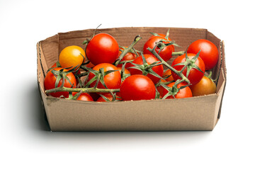 Fresh Red Cherry Tomatoes in a Cardboard Box on a White Background
