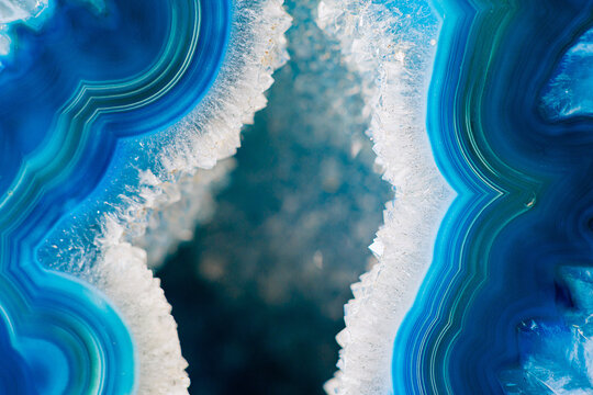 Close-Up of Vibrant Blue Geode Featuring Crystals and Layered Marble Formation