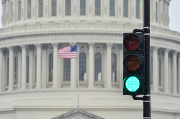 Green light and Capitol in the snow - Red light symbolized a affirmative resolution from the Capitol