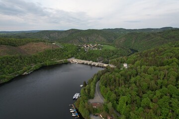 Obraz premium Slapy Reservoir is dam on the Vltava river in the Czech Republic, near to village Slapy. It has a hydroeletrics power station included.Aerial panorama landscape photo 