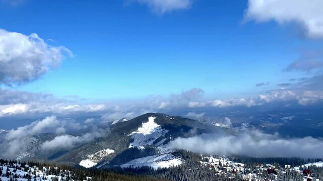 Winter beautiful scenic nature snow mountains aerial panorama on ski resort.Pine fir spruce trees with ice in forest in sunny cold frosty day.Ukrainian Carpathians landscape.