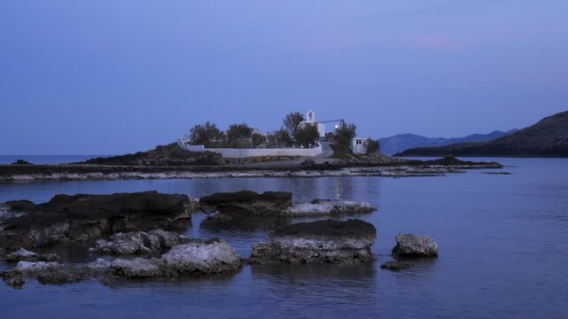 Saint Fokas orthodox chapel in the coast of Greece at sunset