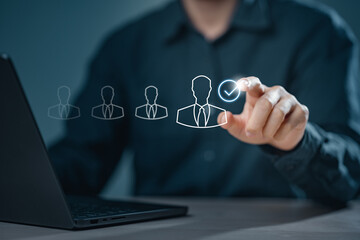 human, resource, hr, career, client, team, company, hiring, management, recruitment. The image is of a man wearing a suit and tie, and he is drawing a person with a check mark on it.