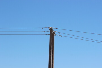 An electric pole with wires