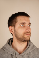 Obraz premium His composed expression and gentle features exude a sense of inner peace. The lighting accentuates the calmness of his demeanor. A man s calm head is shown in this close-up shot.