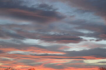 Fototapeta premium Picturesque sunset with aurora-like clouds in shades of pink and blue