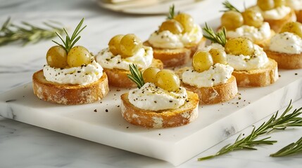 Obraz premium Golden roasted grapes and creamy whipped feta on crunchy crostini, garnished with rosemary sprigs and cracked black pepper, beautifully arranged on a sleek marble board