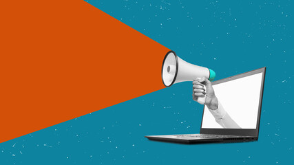 Hand holding a megaphone from laptomonitor on a isolated free white background with clipping path....