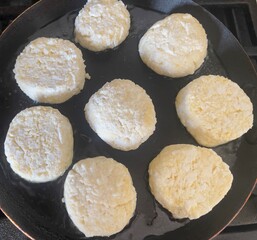 cooking, cottage cheese, preparing cheesecakes, sweet cheesecakes fried in a frying pan