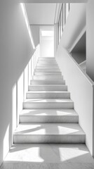 Fototapeta premium White marble staircase receiving light from large windows in modern building