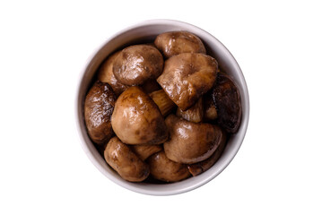 Grilled champignon mushrooms with salt, spices and herbs