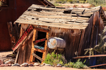 A dilapidated shack with a sign that says 