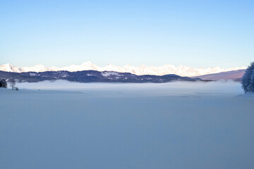 Georgian caucasian mountains covered with snow at sunset in winter. Natural panoramic photography