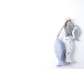 Cute wooden and tin fish figures hanging from a rope