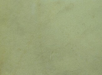 pale grey-yellow background full frame with vague unexpressed uniform texture, fabric or paper blank backdrop of faded tone