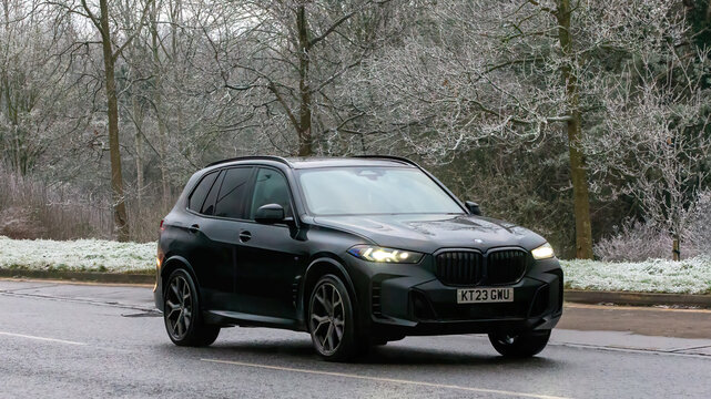 Milton Keynes,UK - Jan 12th 2025:   2023 BMW X5 electric diesel SUV  car driving on a cold,frosty morning