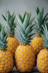 Obraz premium Four ripe pineapples, close-up view.