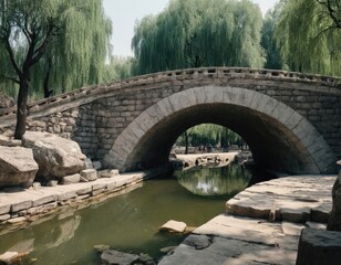 Obraz premium A beautiful stone bridge spans across a river situated in a park
