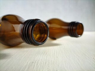 brown bottle on white table