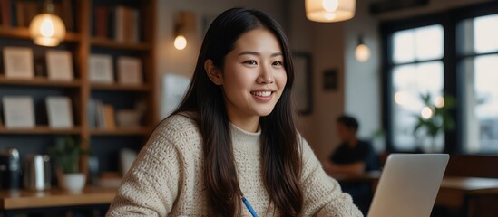 lively coffee shop with ambient background chatter, a motivated Asian woman in a casual sweater is working on a challenging assignment on her laptop