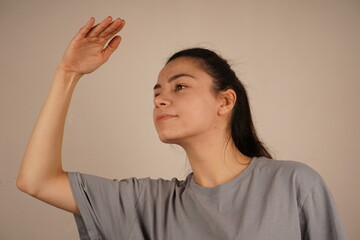 A natural instinct to protect oneself from external light. The hand acts as a shield from the...