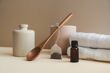 Naklejka premium Spa Essentials Tea Towels Oil And Wooden Spoon