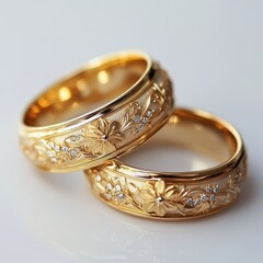 Wedding gold rings with diamonds on a white background. Close up.