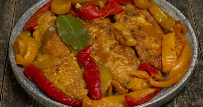 Marinated sweet and sour fish with vegetables. Table spin. 