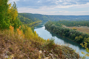 Autumn landscape, view from the high bank of the Sylva River valley.