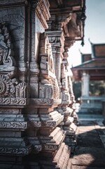 Intricate stone carvings on ancient temple wall.
