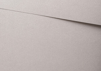Ash gray paper background with a smooth, pearlescent finish and diagonal patterns. Light,...
