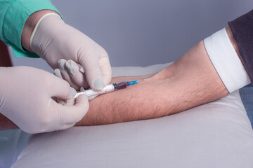 Close up Nurse collecting a blood from a patient