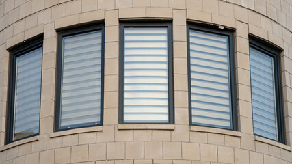 Fototapeta premium Abstract shot of windows on the wall with curvature 