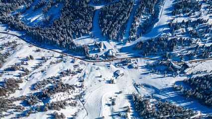 Gruppo del Sella and the famous Sellaronda ski circuit shine in this breathtaking winter aerial view, captured by drone. The Piz Boè station on the Alta Badia ski resort reveals its alpine charm