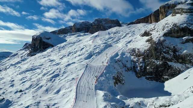 Gruppo del Sella and the famous Sellaronda ski circuit shine in this breathtaking winter aerial view, captured by drone. The Piz Bo&egrave; station on the Alta Badia ski resort reveals its alpine charm