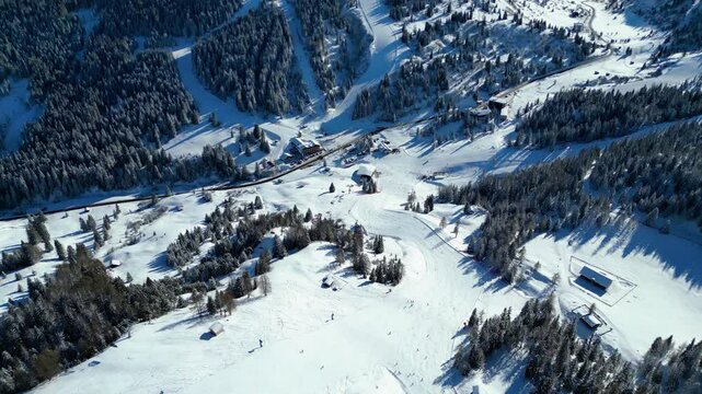 Gruppo del Sella and the famous Sellaronda ski circuit shine in this breathtaking winter aerial view, captured by drone. The Piz Bo&egrave; station on the Alta Badia ski resort reveals its alpine charm