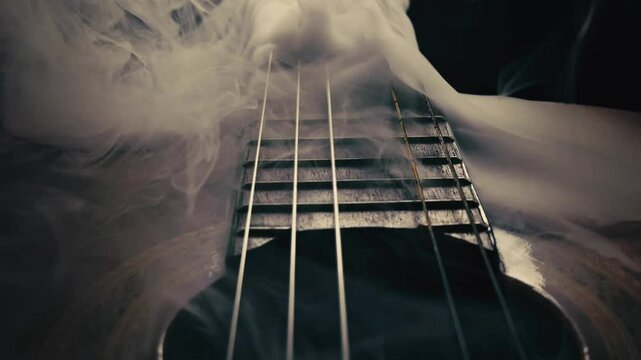 Instrument Classical guitar in smoke with a single string Missing
