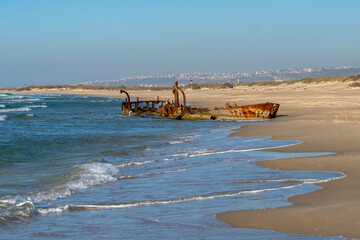 Abandoned rusty shipwreck at HaBonim Beach Nature Reserve on the Mediterranean Sea in Israel.
