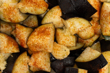 Sliced ​​eggplants close-up. Vegetables prepared for baking on a white background. Copy space, home cooking