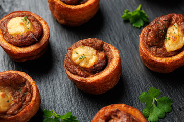 Mini Yorkshire puddings with shredded beef and gravy