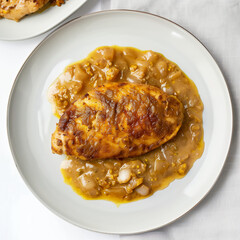 Golden brown chicken breast with sauce