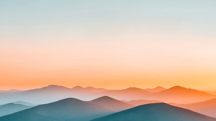 Majestic Mountain Sunset with Vibrant Orange and Soft Blue Hues